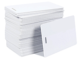 CardPrinting.com photo of a stack of blank white PVC cards with a slot punch on the short side that may be used for vertical ID badges